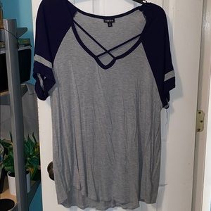 grey top with blue shoulders and chest lining